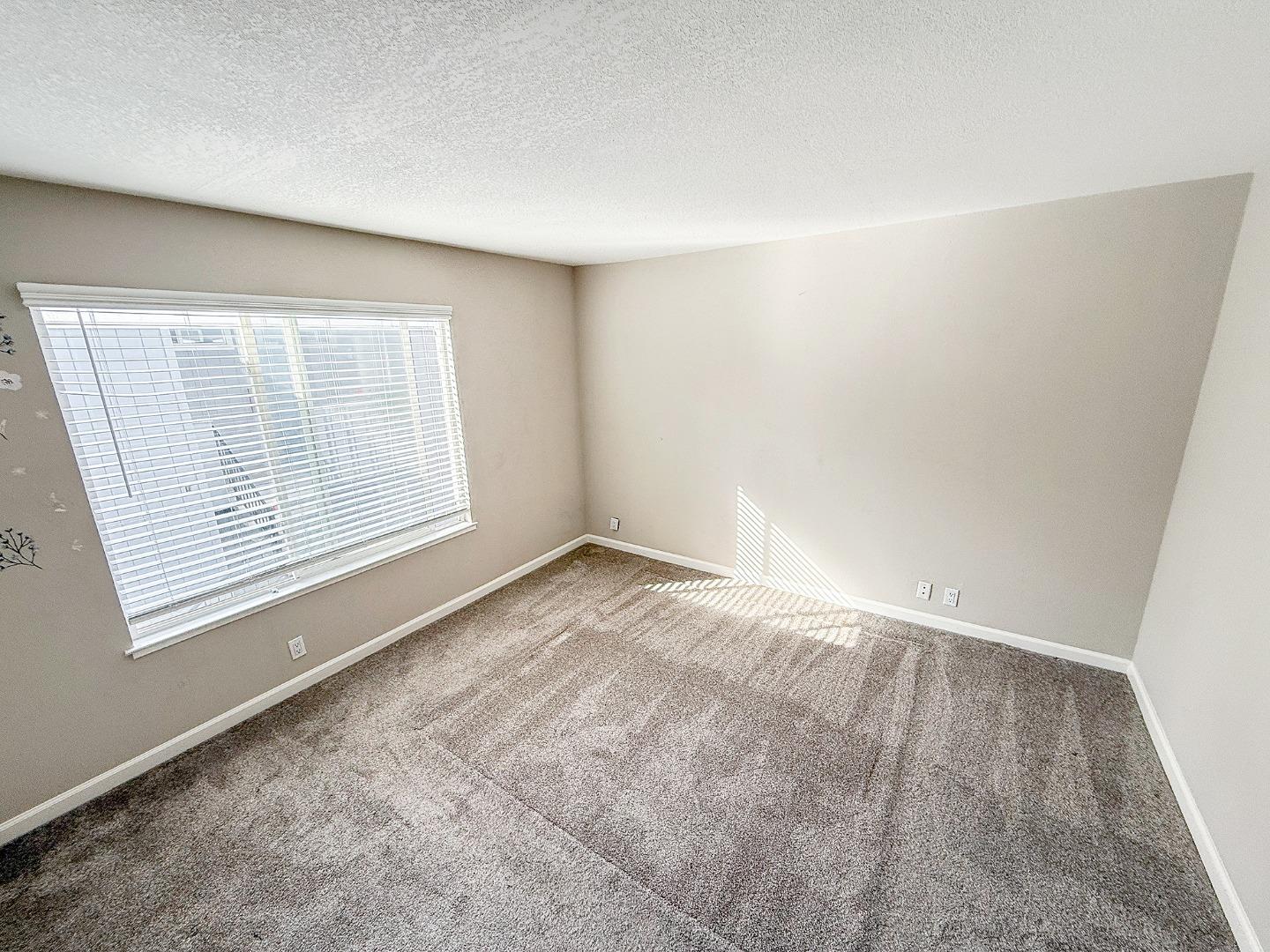 84 Rancho Drive, Unit H San Jose, CA 95111 - Photo 13 of 16 an empty room with windows