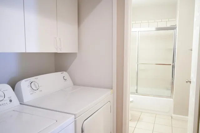 a utility room with dryer and washer