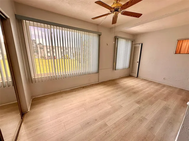 a view of an empty room with a window