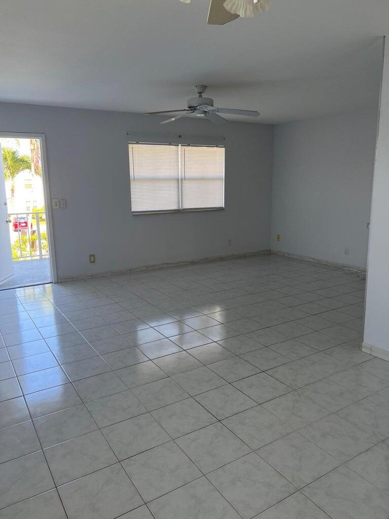 371 Flanders South, Unit 371 Delray Beach, FL 33484 - Photo 6 of 17 an empty room with windows