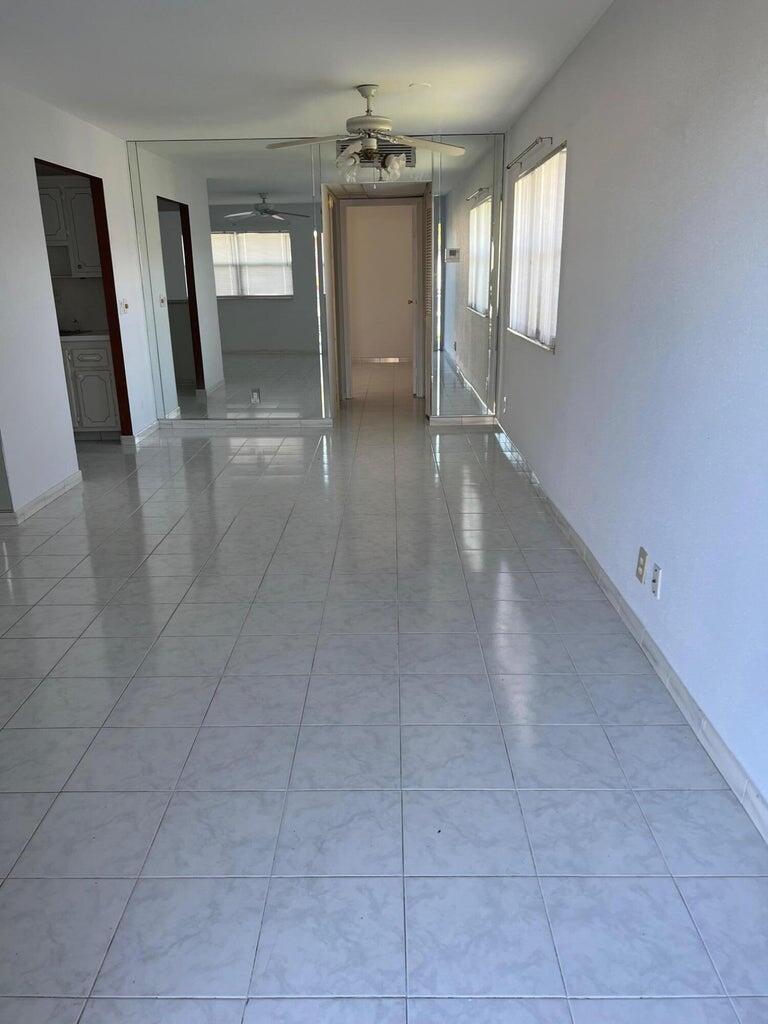 371 Flanders South, Unit 371 Delray Beach, FL 33484 - Photo 7 of 17 a view of livingroom with hardwood floor and a window