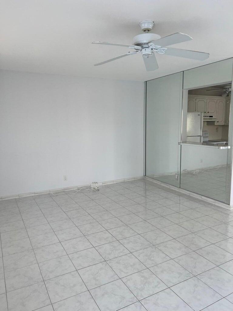371 Flanders South, Unit 371 Delray Beach, FL 33484 - Photo 8 of 17 a view of a room with an empty space and cabinets