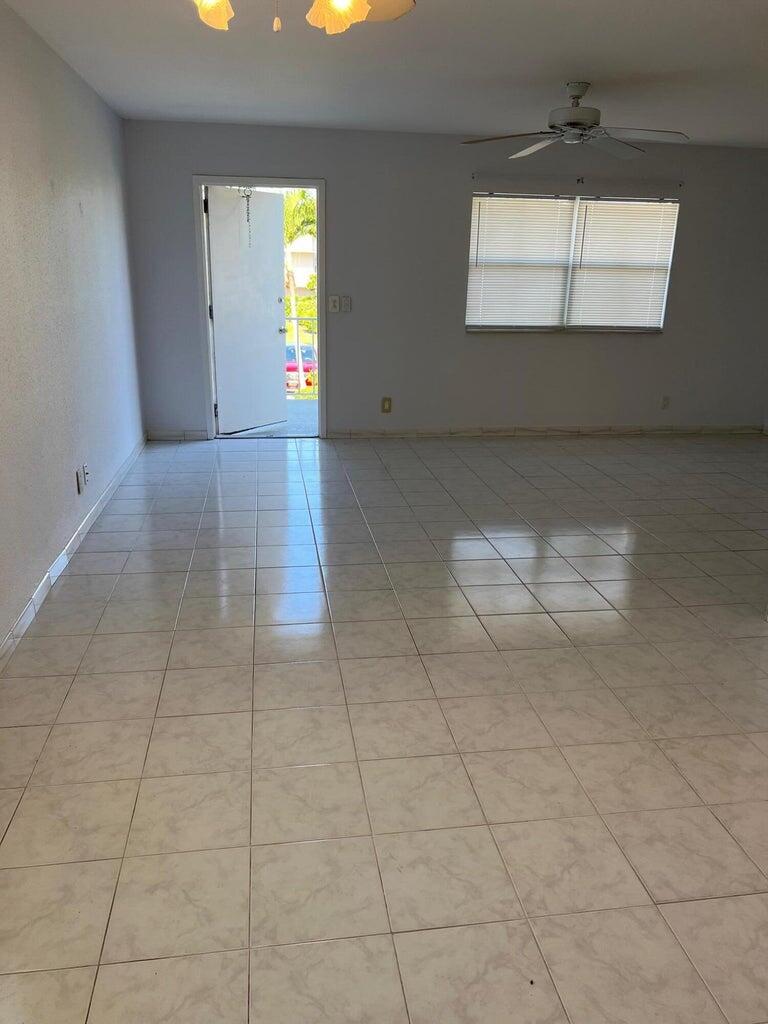 371 Flanders South, Unit 371 Delray Beach, FL 33484 - Photo 9 of 17 a view of empty room with window