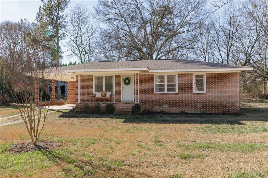 467 Diamond Hill Colbert Road Colbert, GA 30628 - Photo 1 of 1 a view of a house with backyard and sitting area