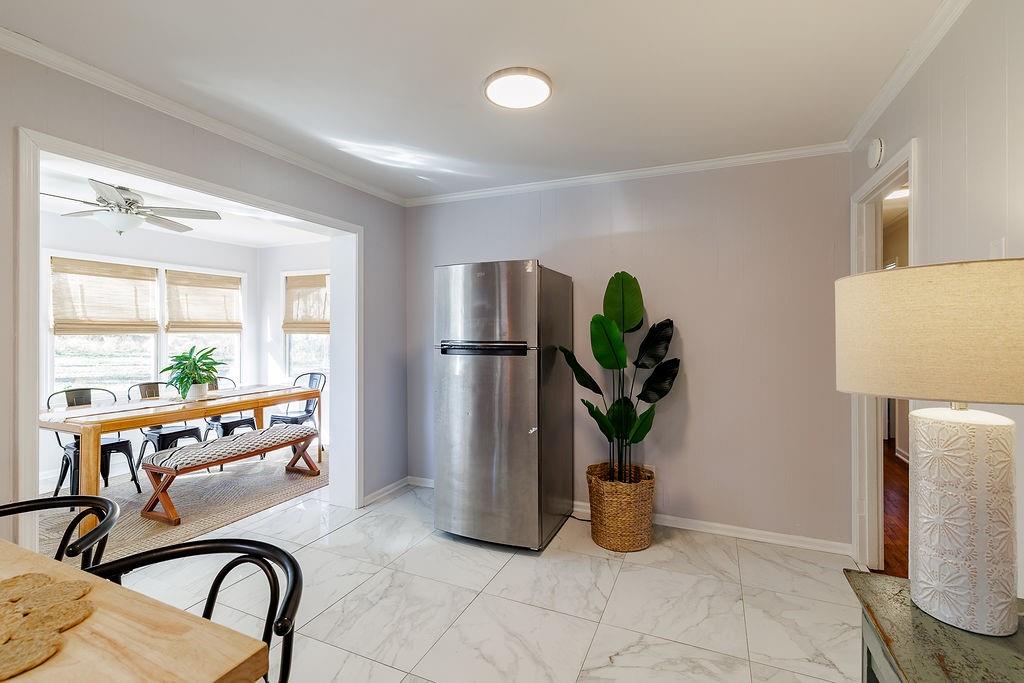 467 Diamond Hill Colbert Road Colbert, GA 30628 - Photo 17 of 50 a kitchen with furniture a potted plant and a large window