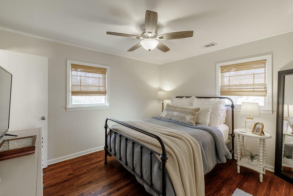 467 Diamond Hill Colbert Road Colbert, GA 30628 - Photo 22 of 50 a bedroom with a bed and wooden floor