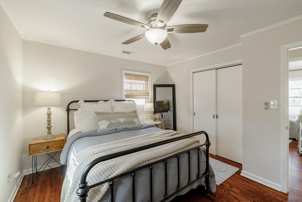 467 Diamond Hill Colbert Road Colbert, GA 30628 - Photo 23 of 50 a bedroom with a bed and a chandelier