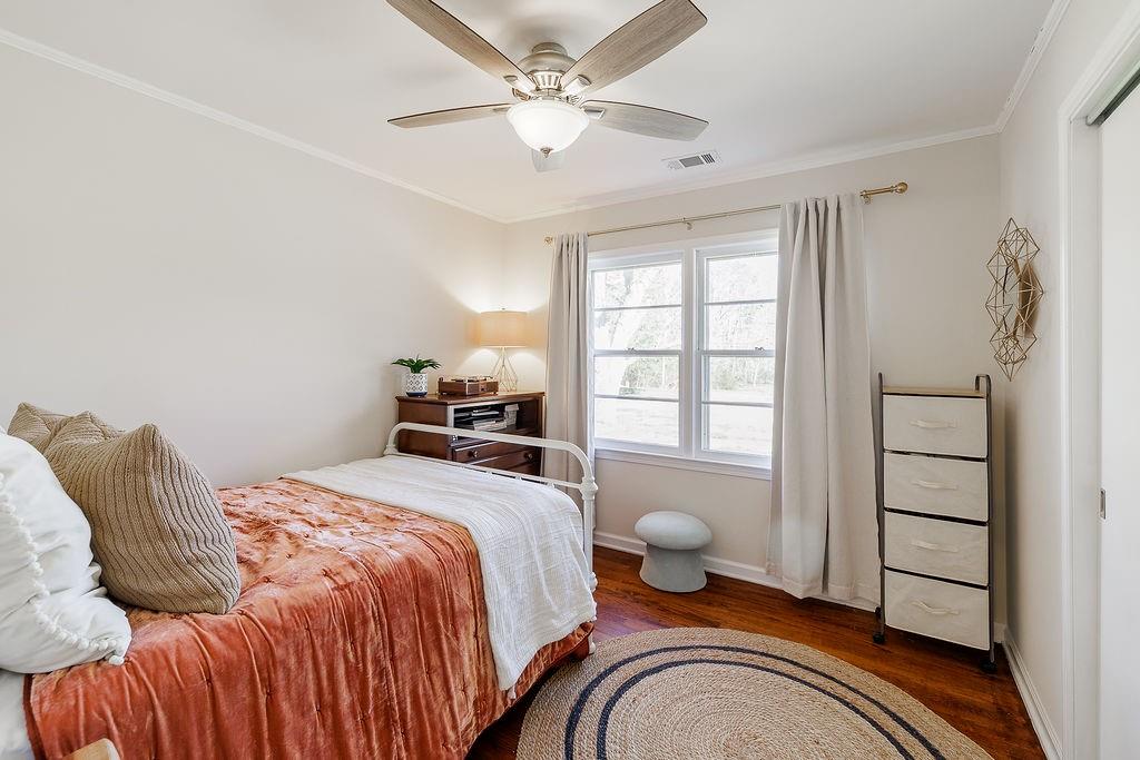 467 Diamond Hill Colbert Road Colbert, GA 30628 - Photo 27 of 50 a bedroom with a bed and wooden floor
