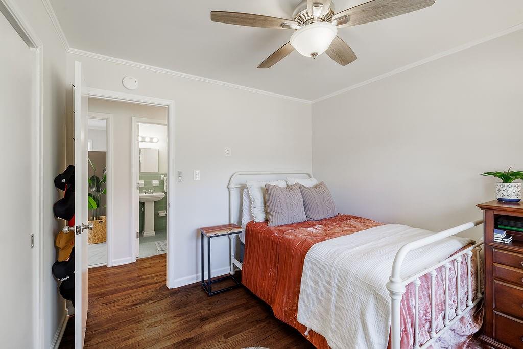 467 Diamond Hill Colbert Road Colbert, GA 30628 - Photo 28 of 50 a bedroom with a bed and a chandelier