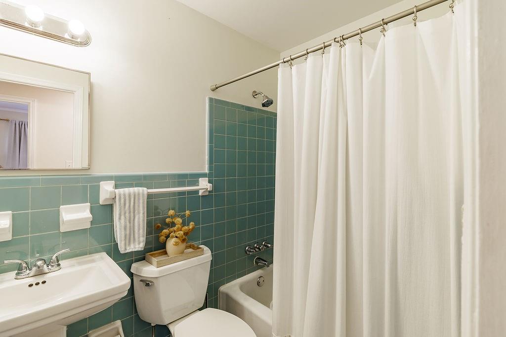 467 Diamond Hill Colbert Road Colbert, GA 30628 - Photo 34 of 50 a bathroom with a toilet sink and mirror