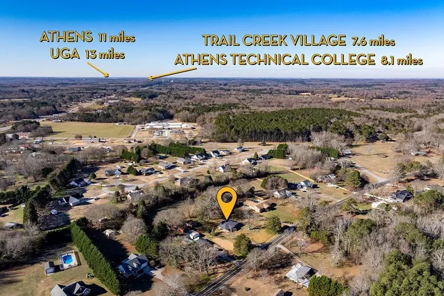 an aerial view of a city and mountain view in back