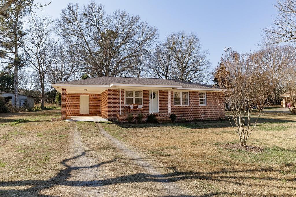467 Diamond Hill Colbert Road Colbert, GA 30628 - Photo 48 of 50 a view of a yard in front of a house with a patio