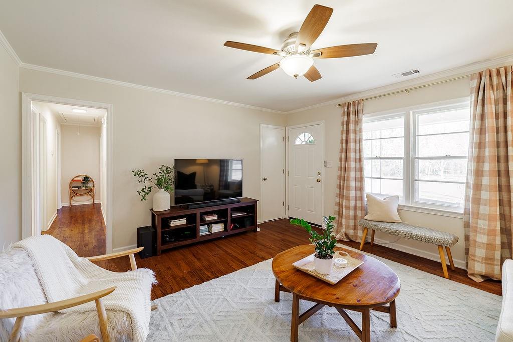 467 Diamond Hill Colbert Road Colbert, GA 30628 - Photo 7 of 50 a living room with furniture and a flat screen tv with wooden floor