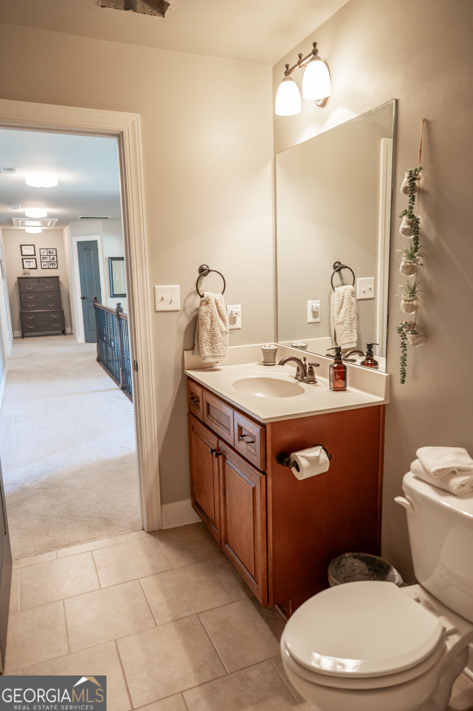 415 EAS Way Fayetteville, GA 30215 - Photo 40 of 70 a bathroom with a sink vanity mirror and toilet