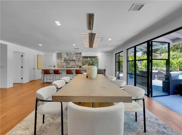 a kitchen with a stove and a white cabinet