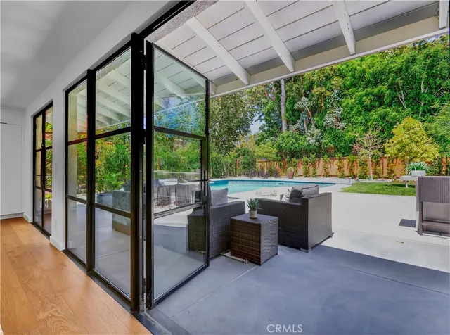 a kitchen with stainless steel appliances granite countertop a sink and a refrigerator