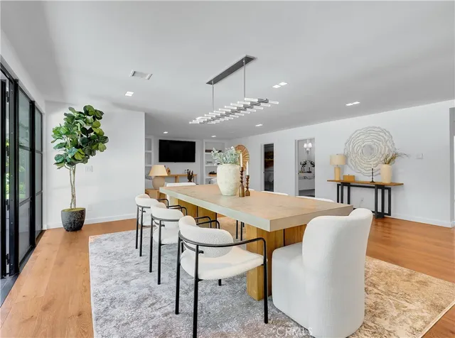 a large kitchen with stainless steel appliances granite countertop a lot of counter space and a sink