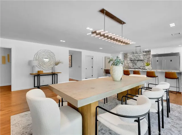 a kitchen with sink and view of living room