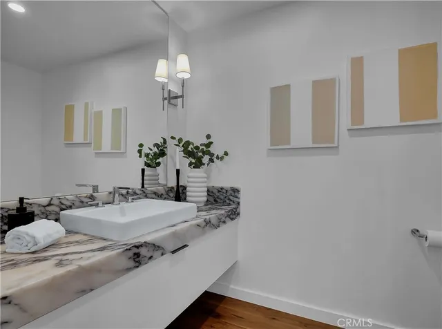 a large white kitchen with a large window