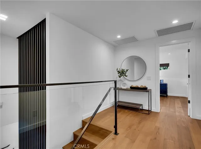 a bedroom with a large bed and a flat screen tv