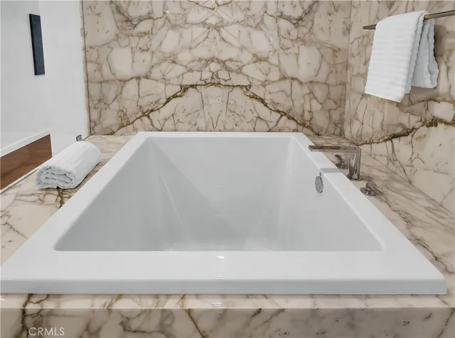 a view of a house with potted plants