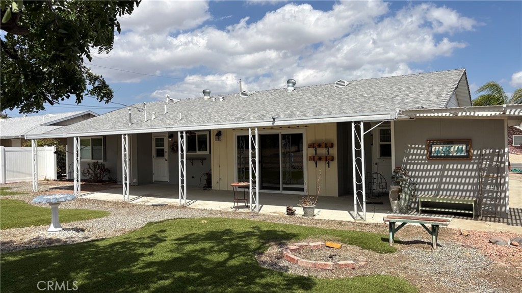 26378 Ridgemoor Road Menifee, CA 92586 - Photo 17 of 20 a view of a house with backyard sitting area and garden