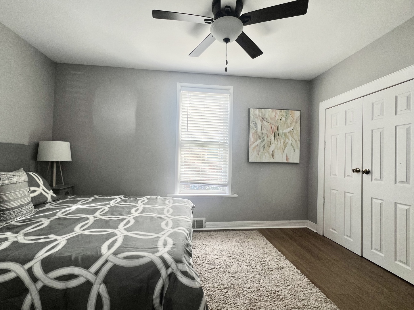 7113 Clarendon Hills Road Darien, IL 60561 - Photo 11 of 35 a bedroom with a bed and wooden floor