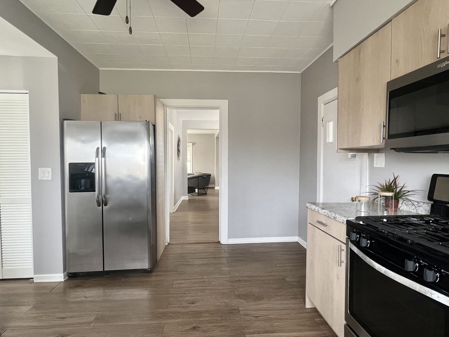 7113 Clarendon Hills Road Darien, IL 60561 - Photo 14 of 35 a kitchen with stainless steel appliances granite countertop a refrigerator and a stove top oven