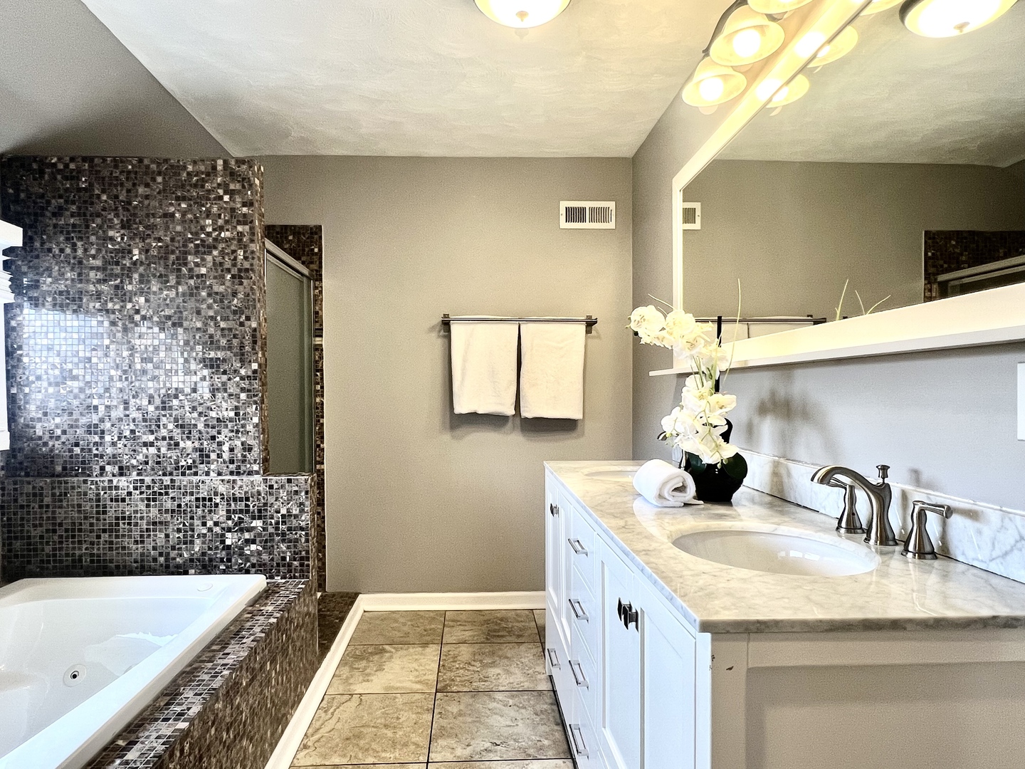 7113 Clarendon Hills Road Darien, IL 60561 - Photo 33 of 35 a bathroom with a granite countertop sink a mirror and shower