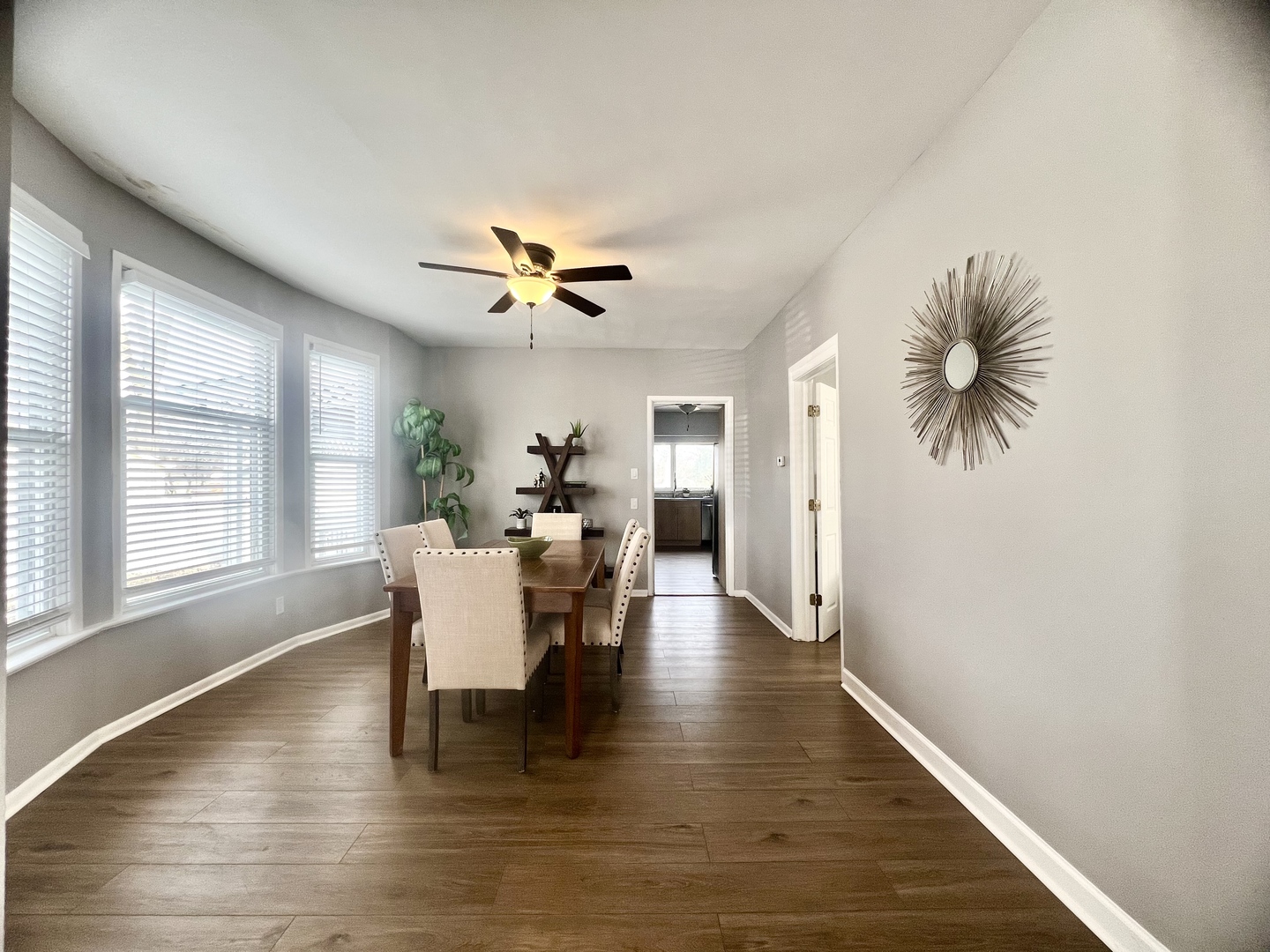 7113 Clarendon Hills Road Darien, IL 60561 - Photo 6 of 35 a dining room with furniture a window and wooden floor
