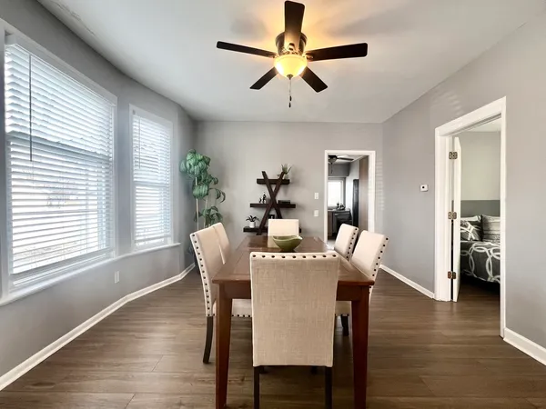 a dining room with furniture window wooden floor