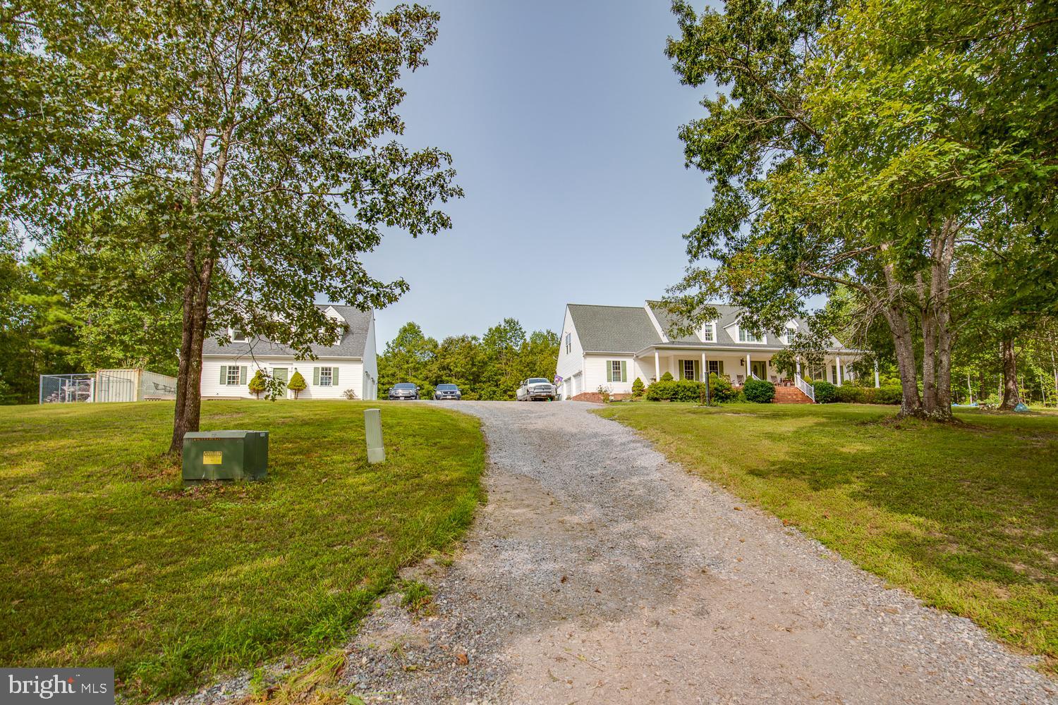 23210 Friendship Road Ruther Glen, VA 22546 - Photo 1 of 58 A winding driveway leads to your home on a hill