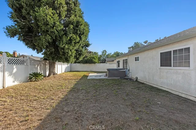 a view of a backyard of the house
