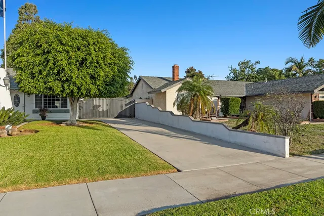 a swimming pool with outdoor seating and yard