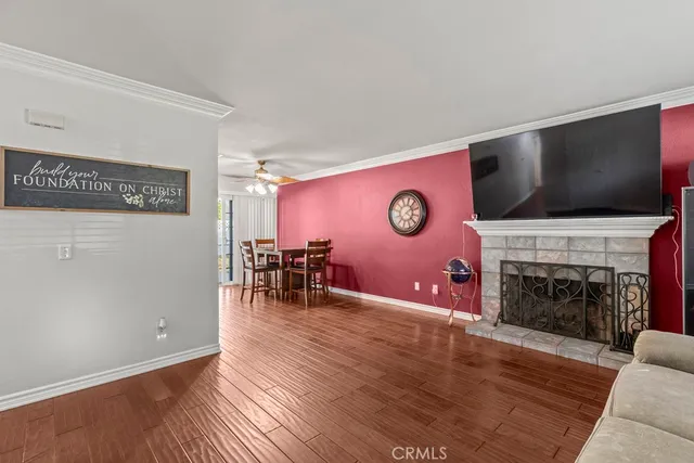 a living room with fireplace furniture and a flat screen tv
