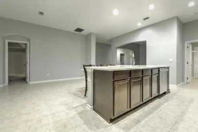 a kitchen with kitchen island cabinets and window