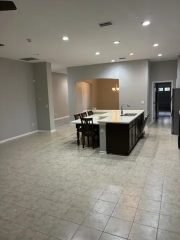 a kitchen with a sink and counter top space