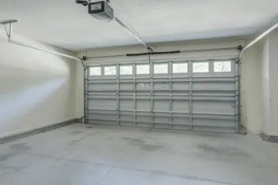 a view of an empty room and a window