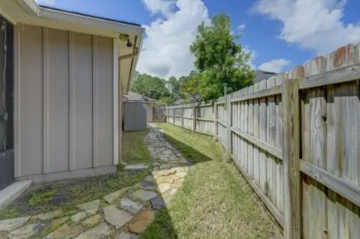 a view of balcony with wooden fence