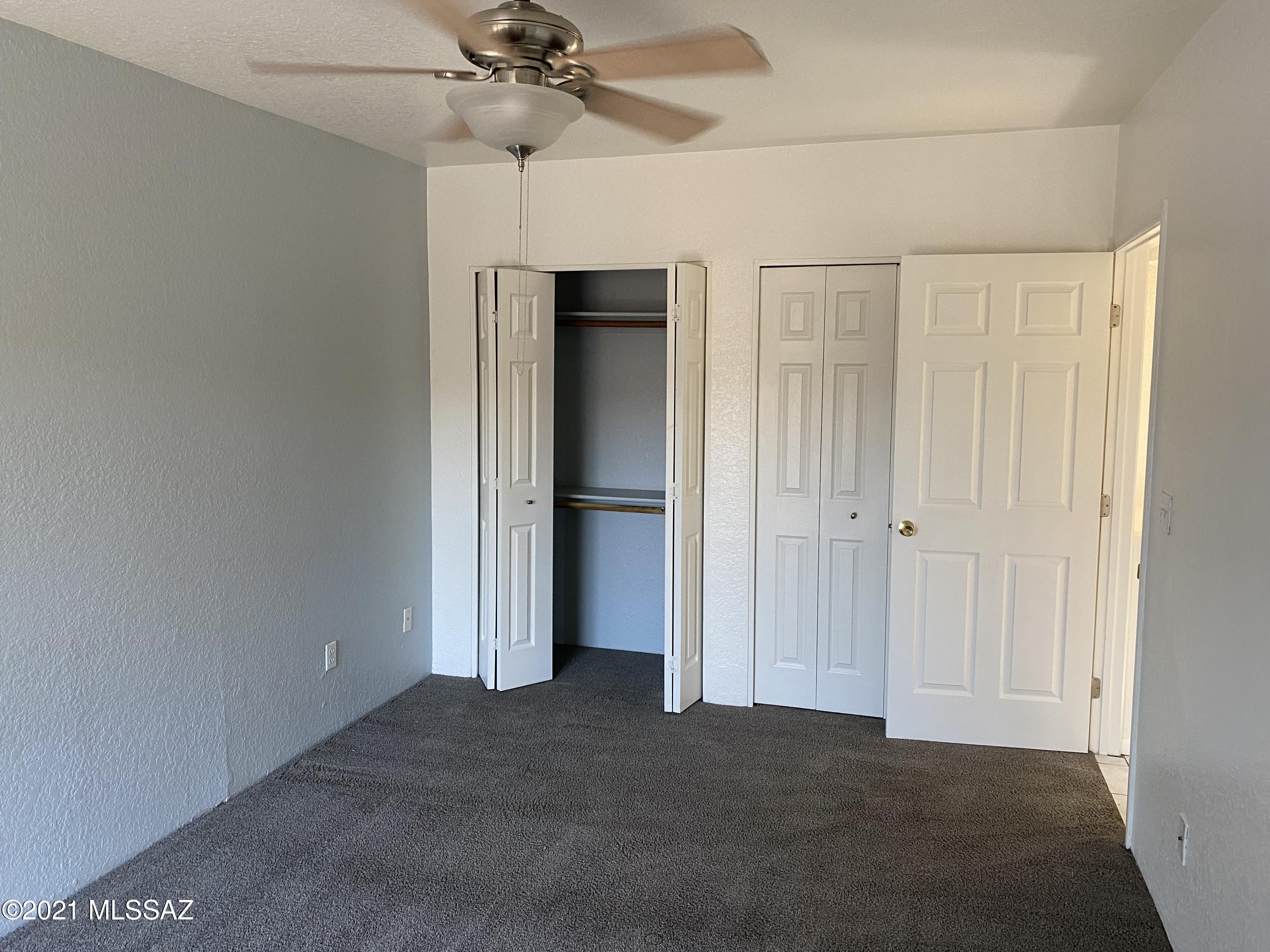 210 East Pastime Road Tucson, AZ 85705 - Photo 19 of 29 a view of empty room with a ceiling fan