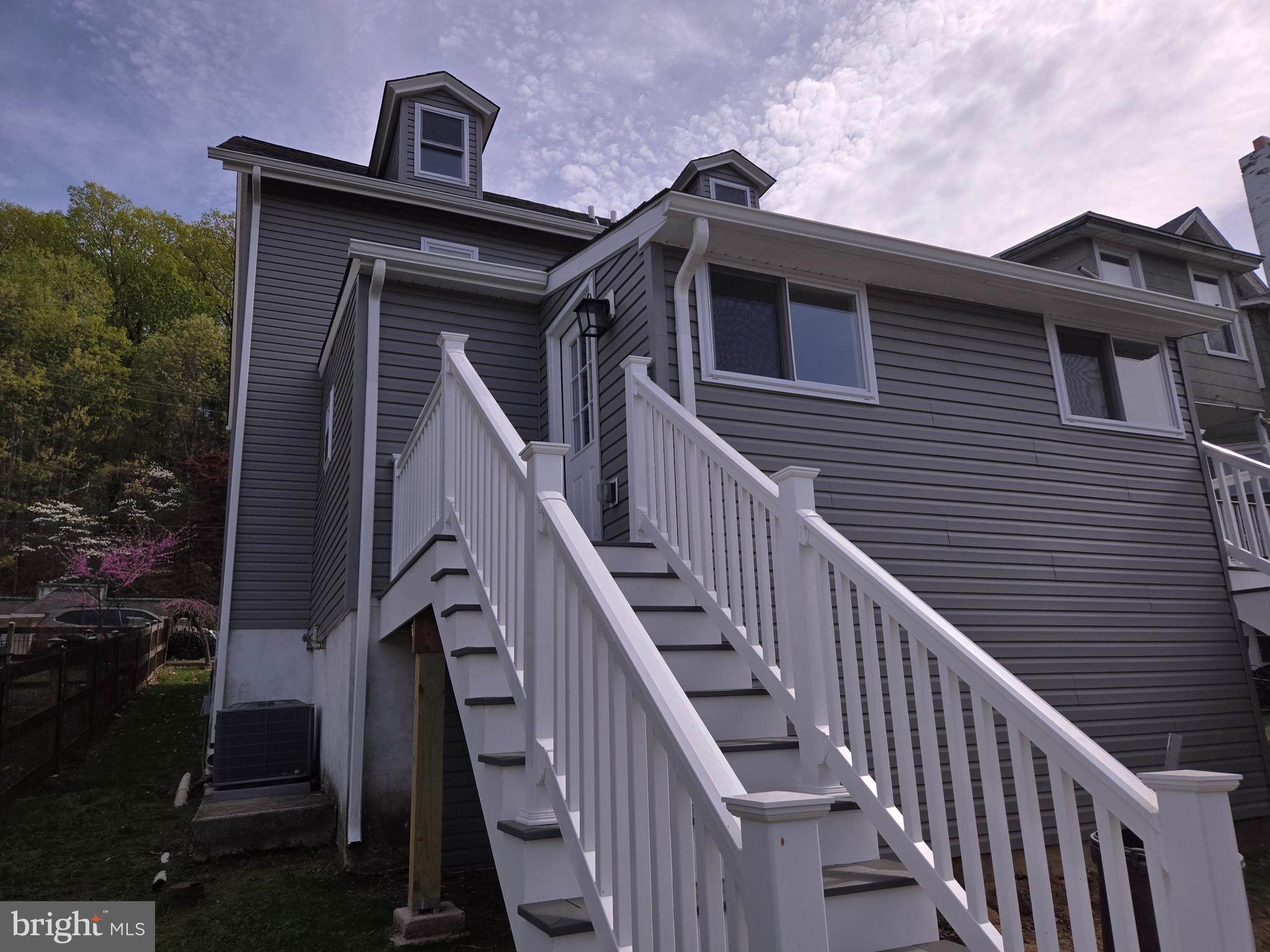 2540 Mount Road, Unit A Aston, PA 19014 - Photo 13 of 14 a front view of a house with wooden fence