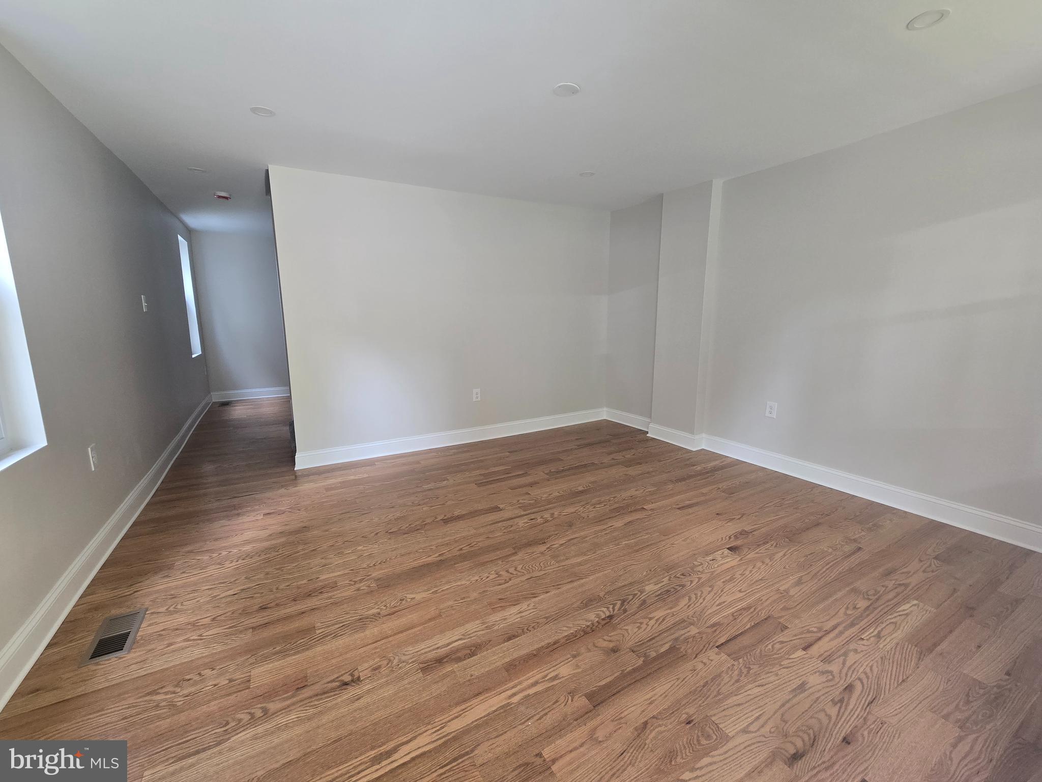 2540 Mount Road, Unit A Aston, PA 19014 - Photo 3 of 14 a view of an empty room with wooden floor