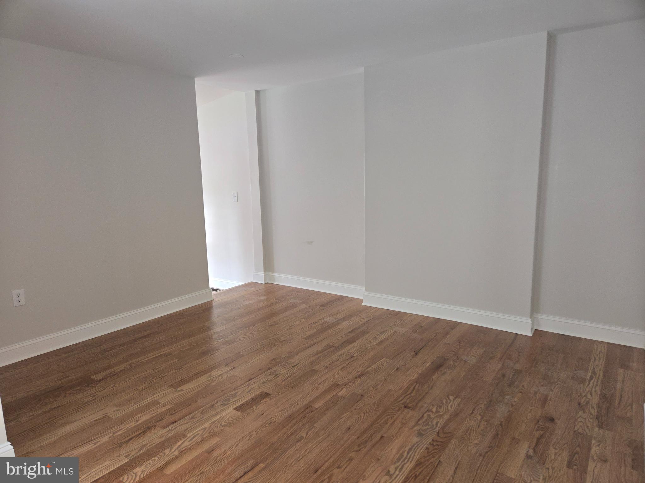2540 Mount Road, Unit A Aston, PA 19014 - Photo 4 of 14 a view of an empty room with wooden floor