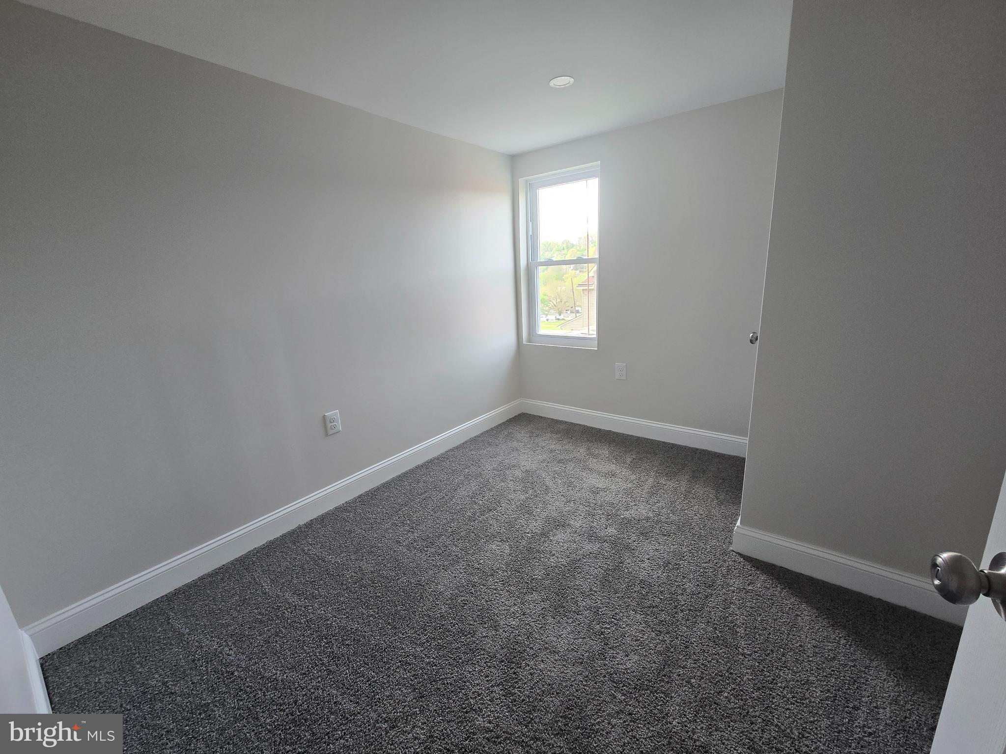 2540 Mount Road, Unit A Aston, PA 19014 - Photo 8 of 14 an empty room with a window