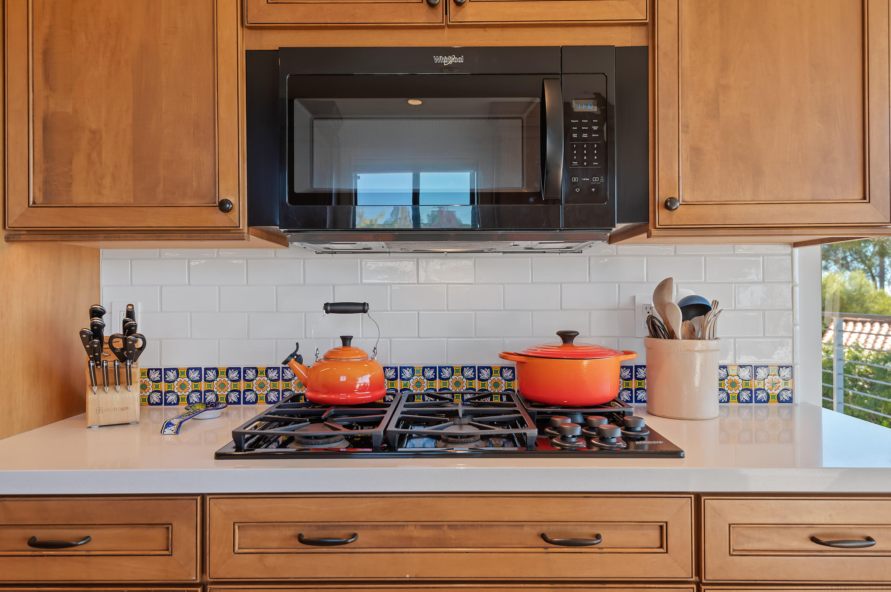 10 Rincon Vista Road Santa Barbara, CA 93103 - Photo 19 of 40 a kitchen with stainless steel appliances granite countertop white cabinets and a stove