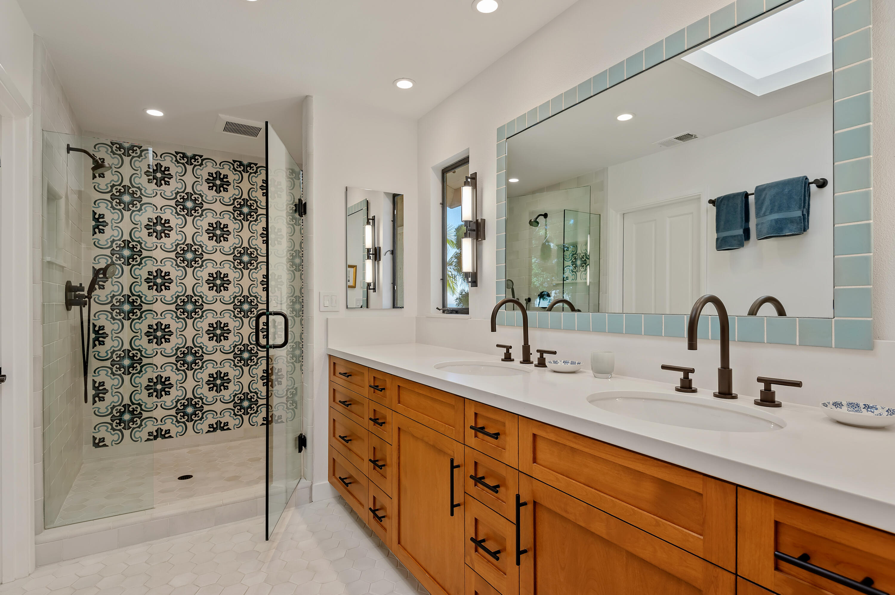 10 Rincon Vista Road Santa Barbara, CA 93103 - Photo 22 of 40 a bathroom with a double vanity sink mirror and shower