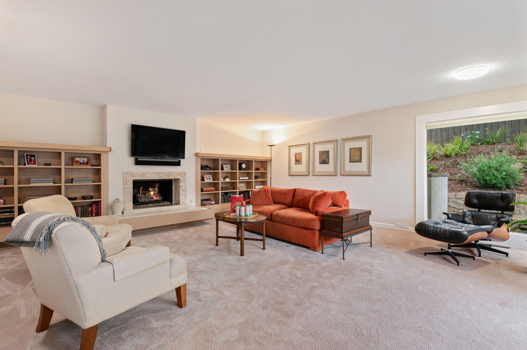 10 Rincon Vista Road Santa Barbara, CA 93103 - Photo 24 of 40 a living room with furniture a fireplace and a flat screen tv