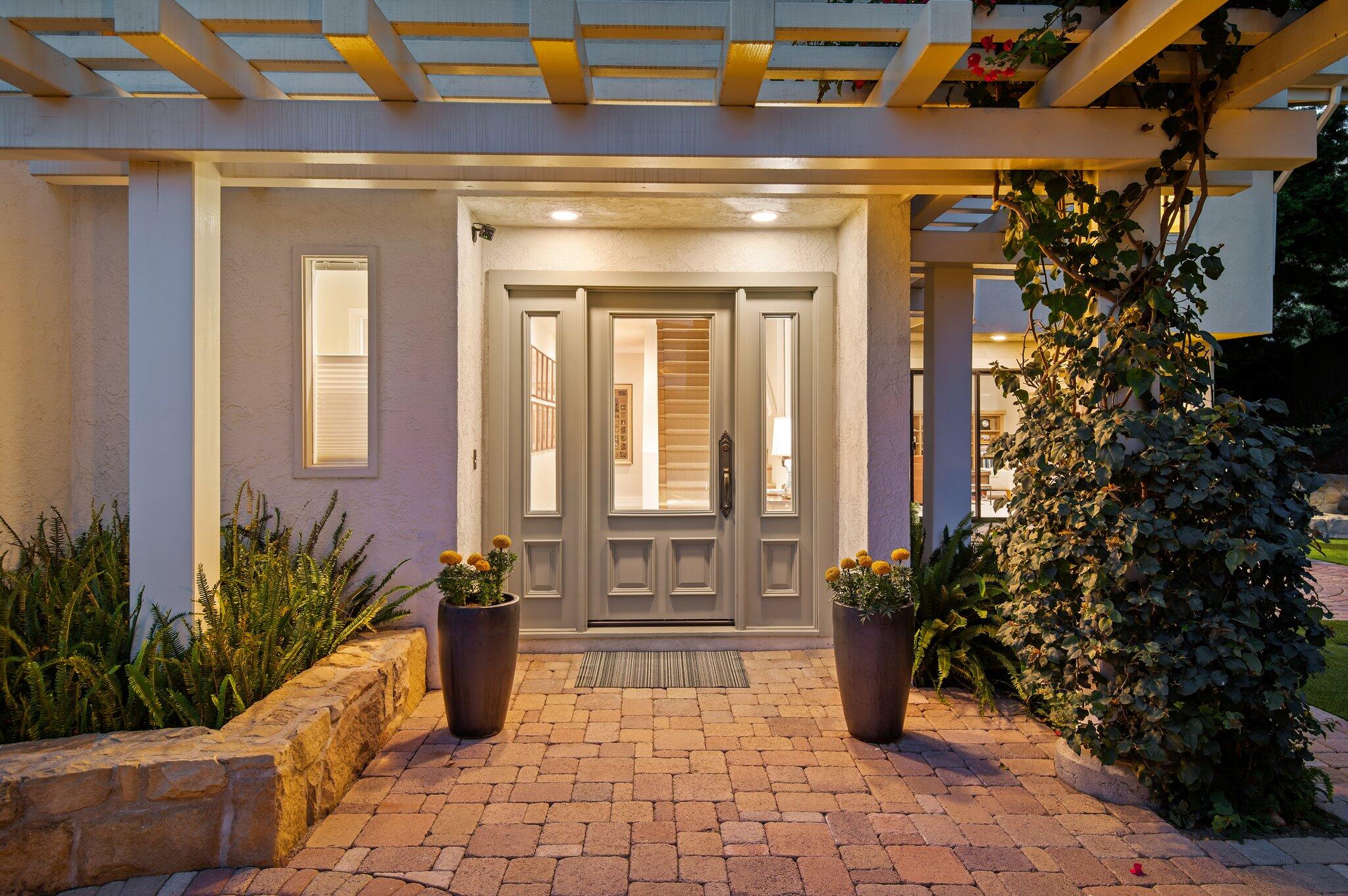 10 Rincon Vista Road Santa Barbara, CA 93103 - Photo 3 of 40 a entryway door of the house with potted plants