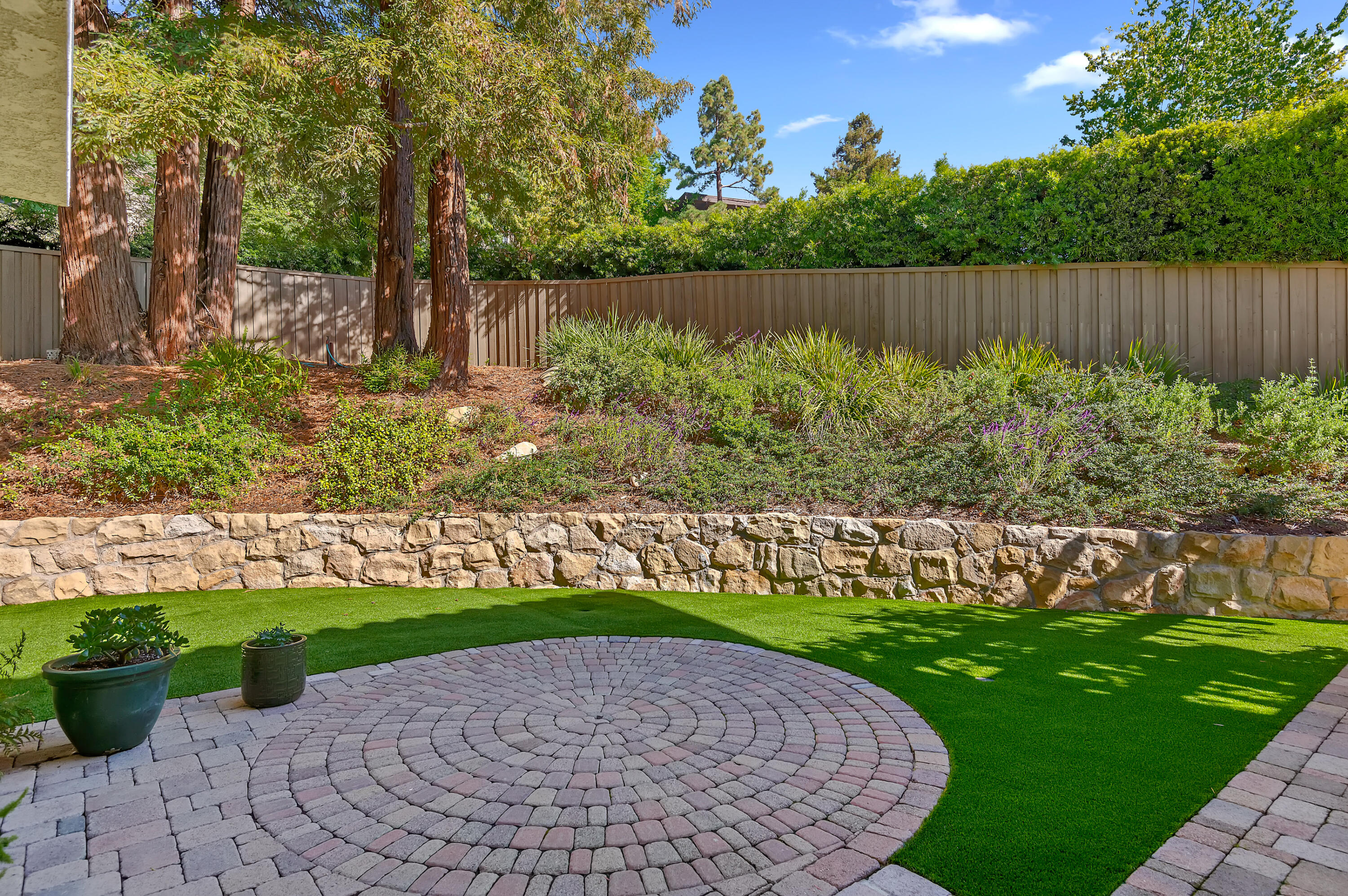 10 Rincon Vista Road Santa Barbara, CA 93103 - Photo 35 of 40 a view of a garden with a bench