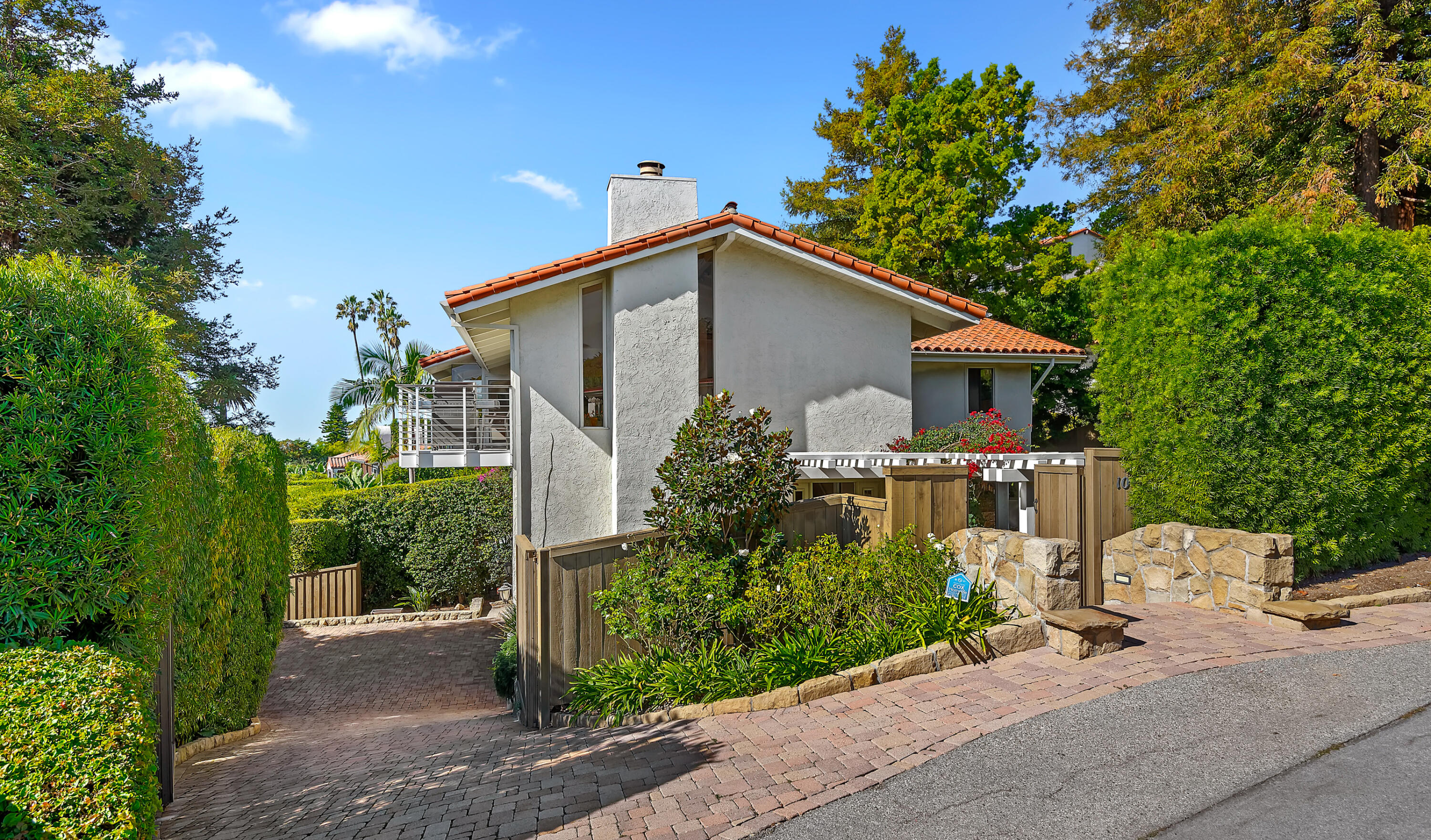 10 Rincon Vista Road Santa Barbara, CA 93103 - Photo 37 of 40 a white house with a small yard plants